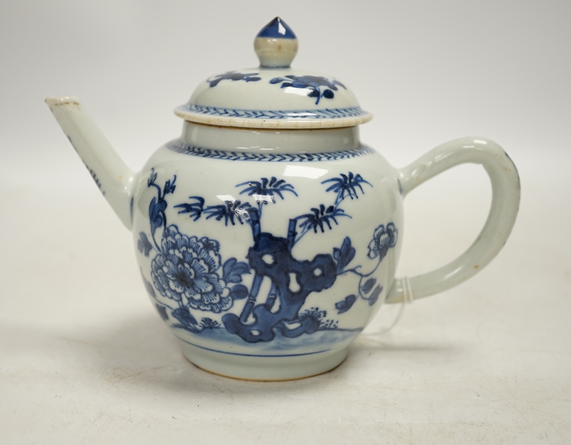 A Chinese blue and white teapot and cover, Qianlong period, 13cm high. Condition - fair